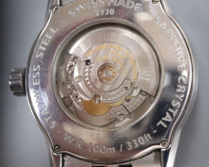 A gentlemans modern stainless steel Raymond Weil automatic wrist watch, with original box.